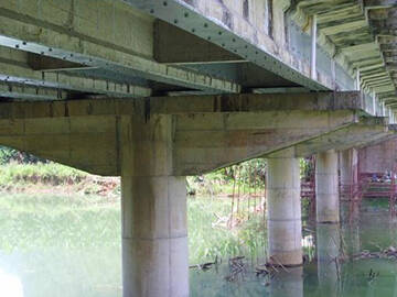 Epoxy bonded steel plate reinforcement on the bridge