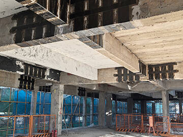 Rehabilitation of Reinforced Concrete Beams Using Carbon Fiber